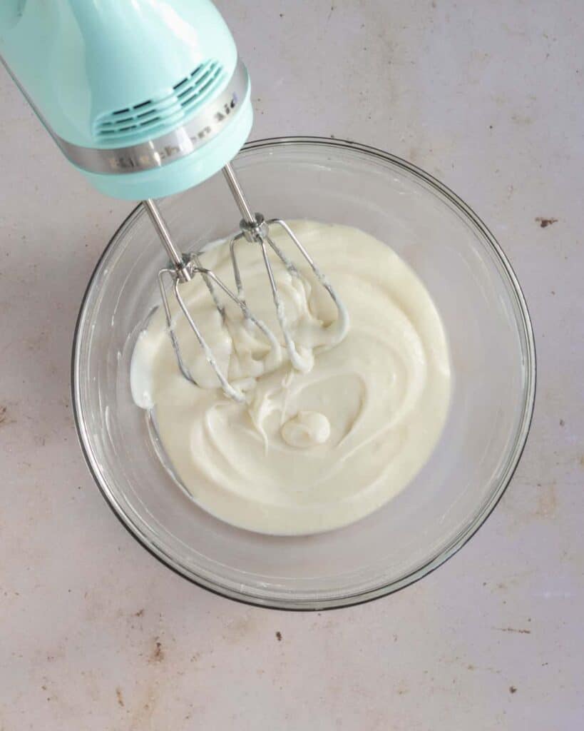 cream cheese frosting whipped up in a bowl