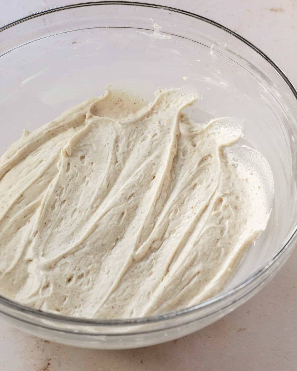 brown butter maple frosting swirled in a glass bowl 