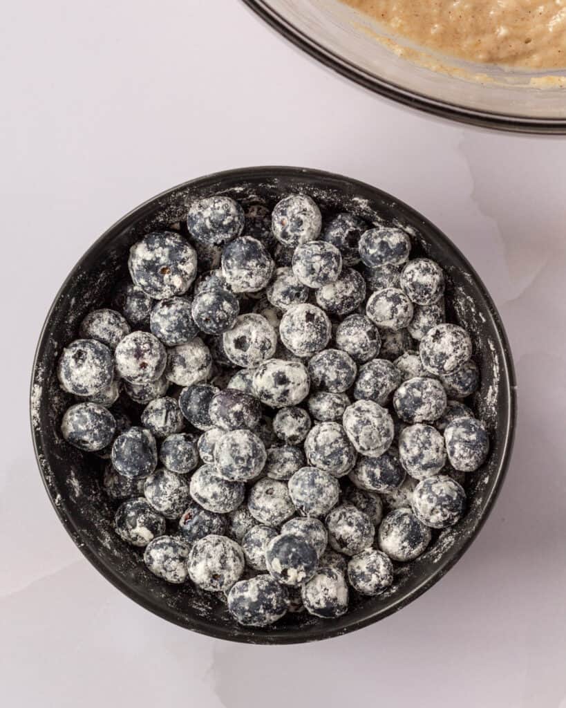 a bowl of blueberries tossed in flour