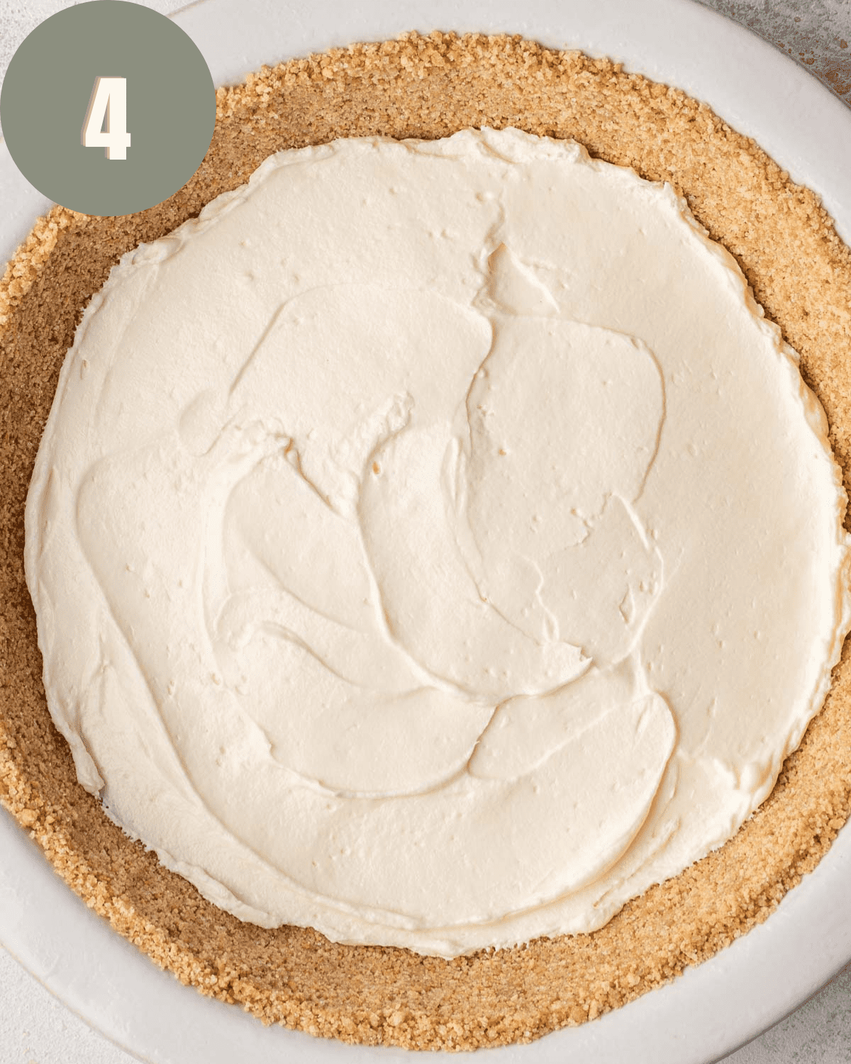 cream cheese mixture spread into the bottom of a graham cracker crust