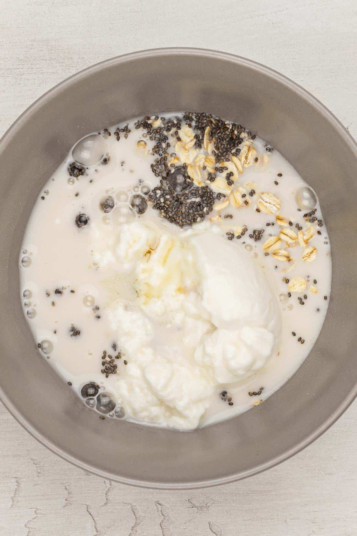 all raspberry overnight oats ingredients together in a mixing bowl.