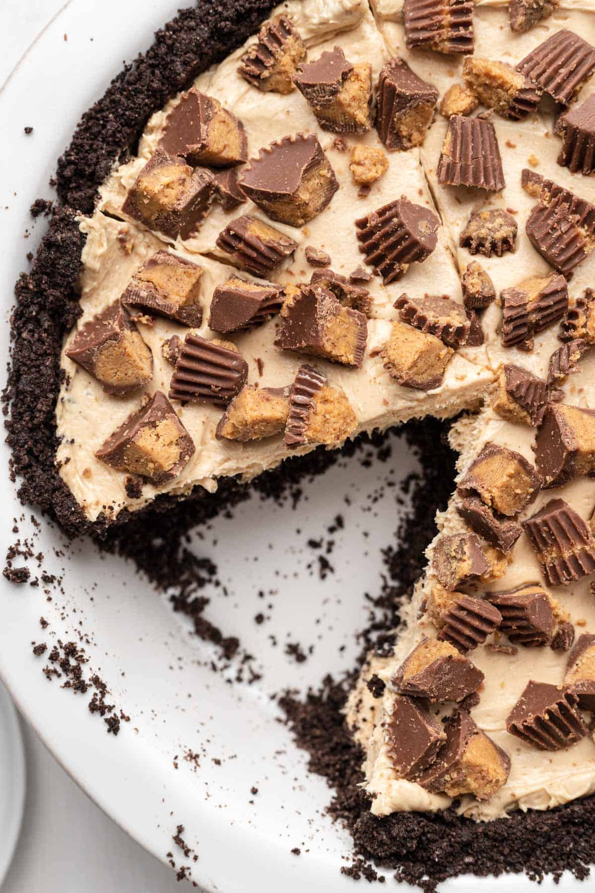 overhead view of peanut butter pie with a slice taken out