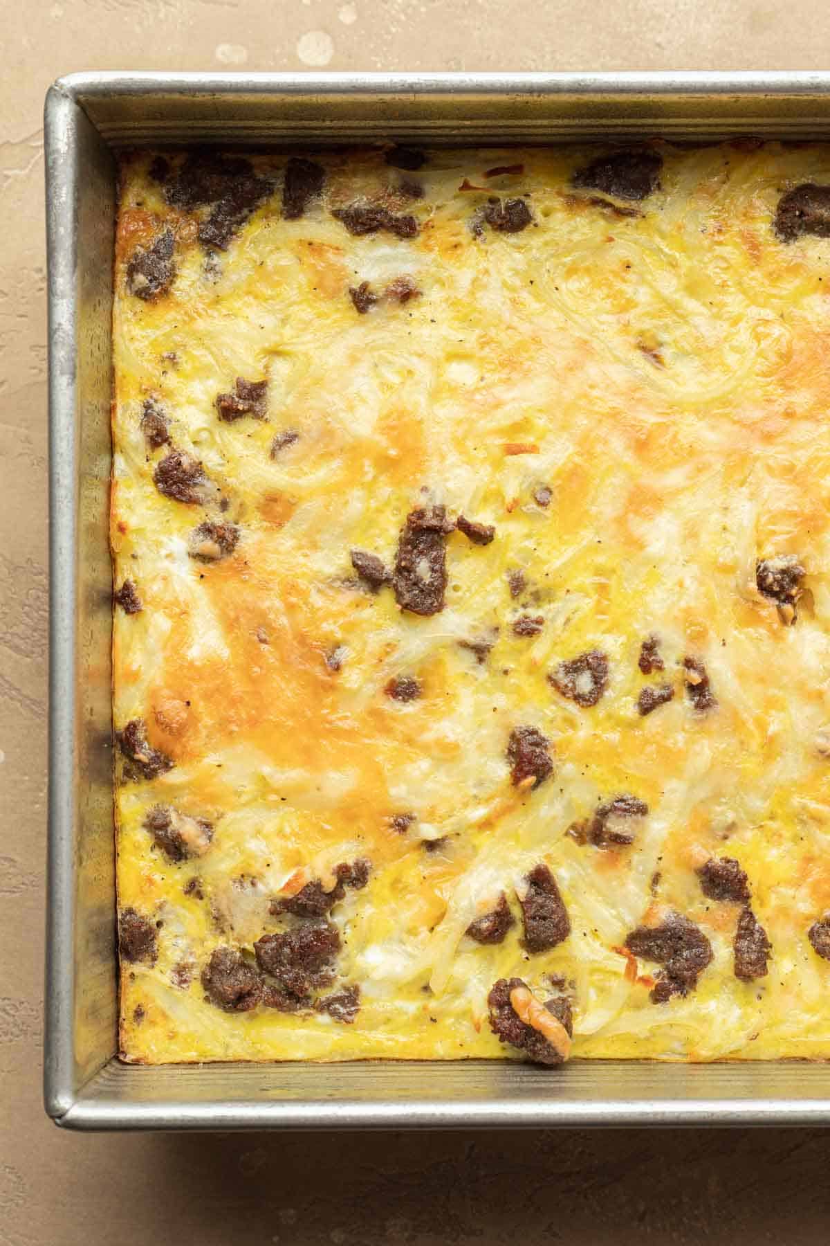Close up of freshly baked Dairy-Free breakfast casserole in casserole dish. 