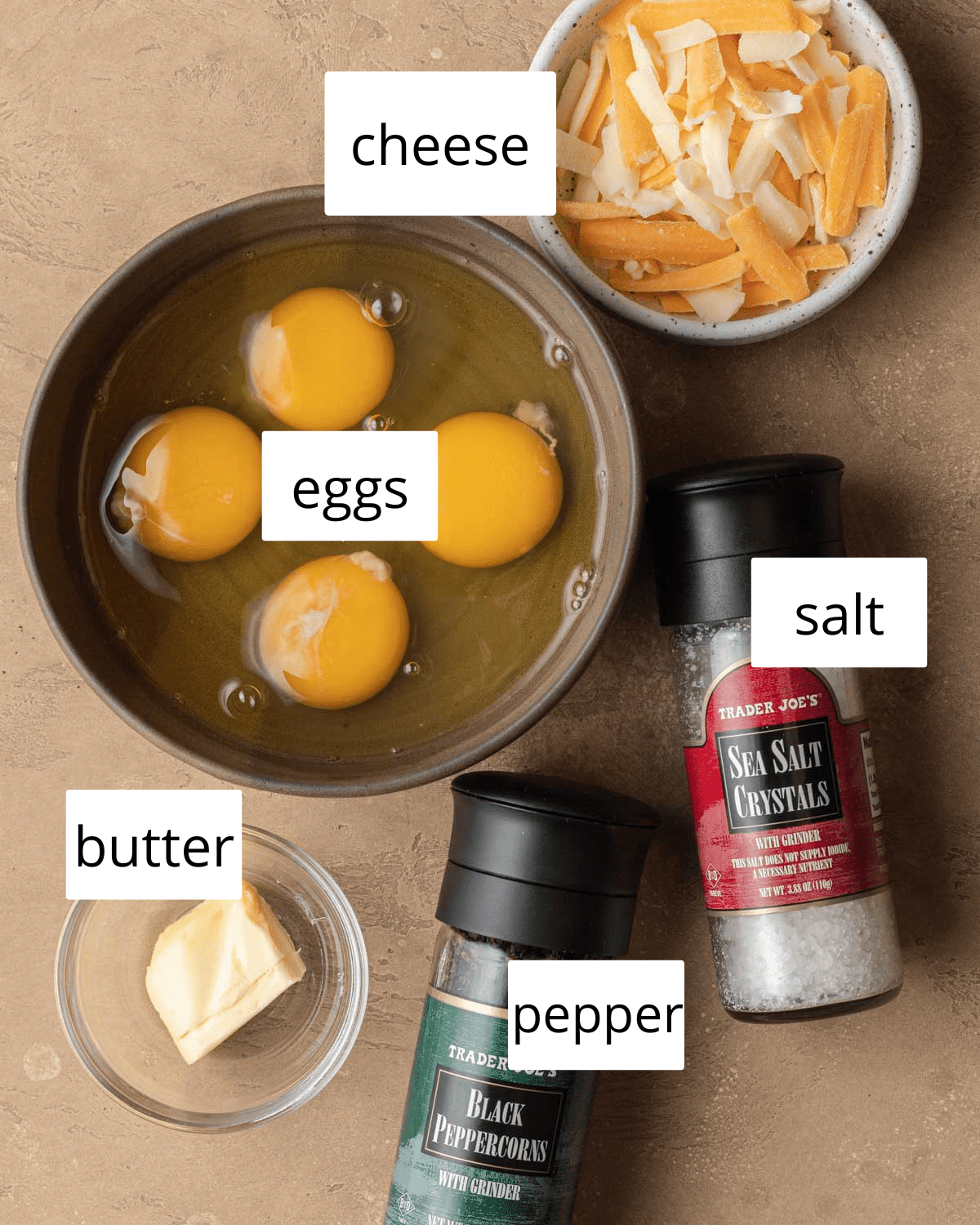 Ingredients to make cheesy scrambled eggs.