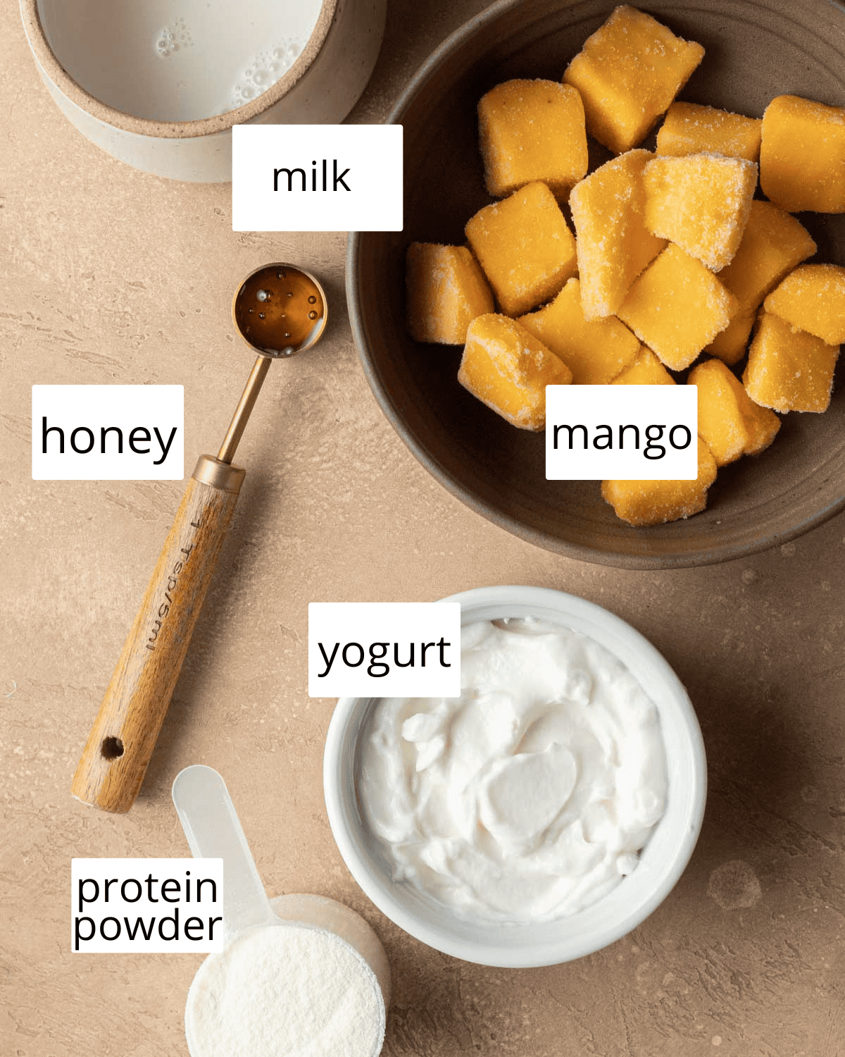 Ingredients to make mango protein smoothie. 
