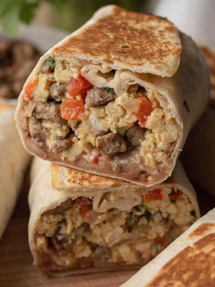 two halves of breakfast burrito stacked on top of one another