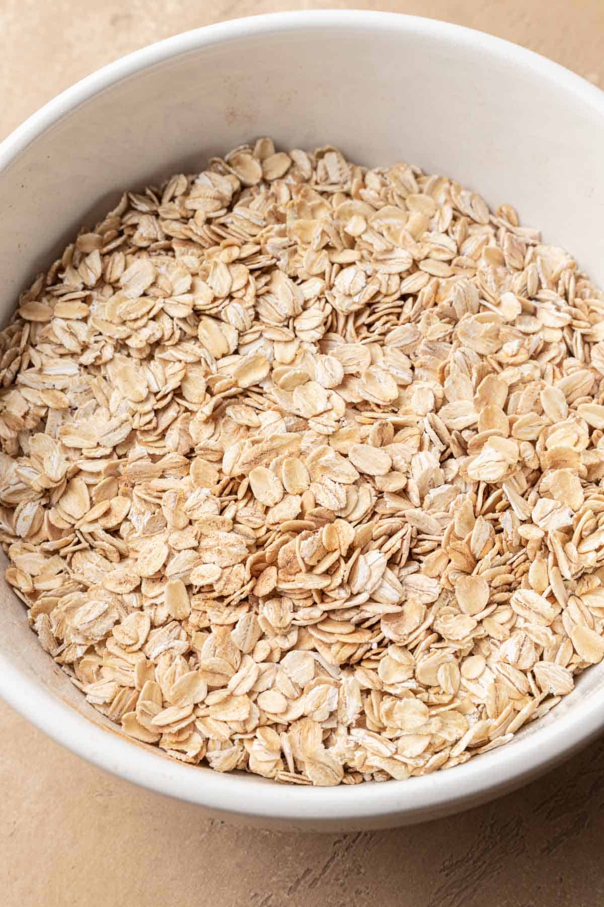 Dried ingredients in a white glass mixing bowl.