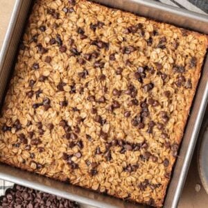 Chocolate chip baked oatmeal freshly baked sitting in a tin baking sheet.