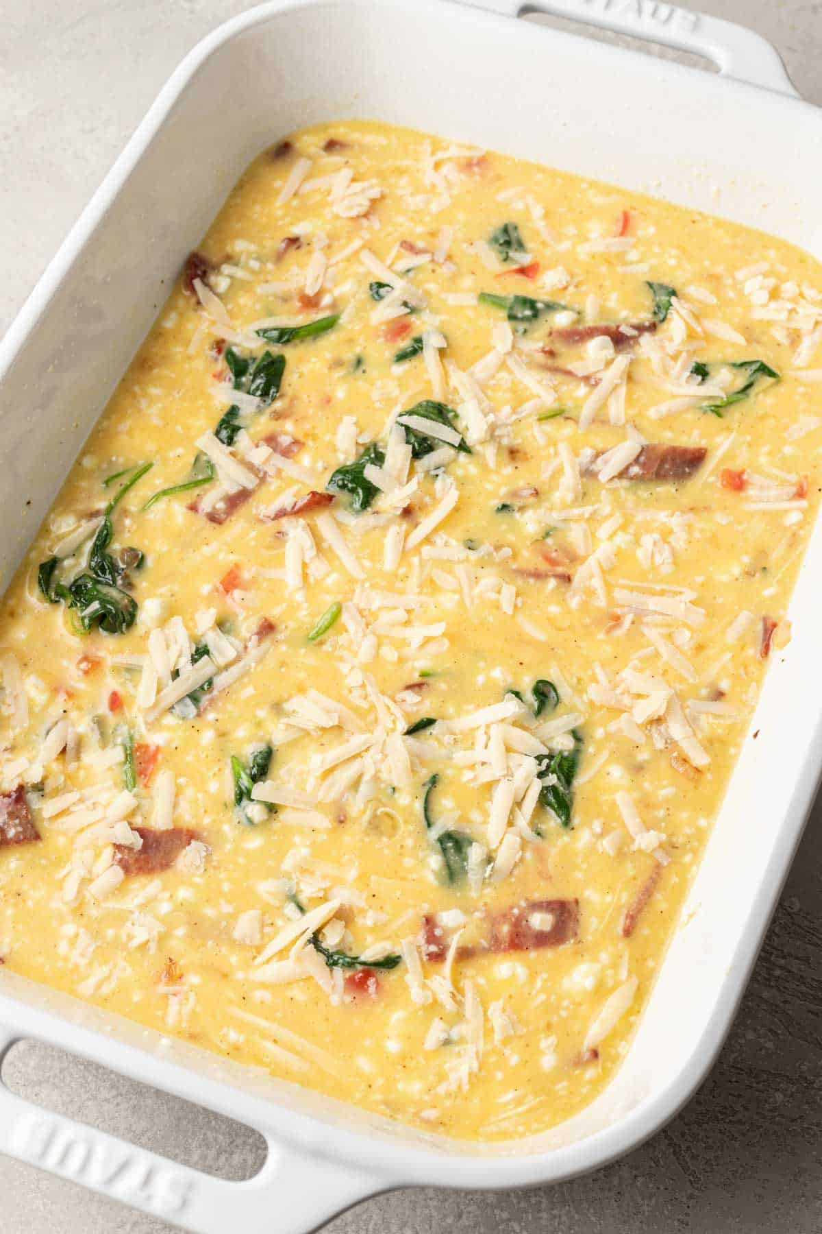 eggs added to casserole dish with cheese sprinkled on top before baking.