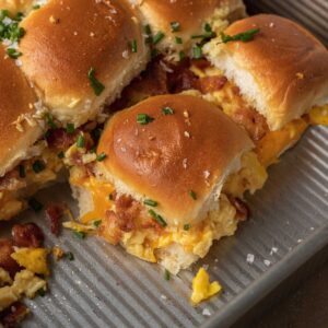 breakfast sliders pulled apart from rest of sliders in a baking pan