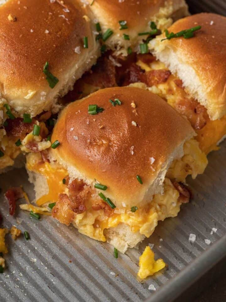 breakfast sliders pulled apart from rest of sliders in a baking pan
