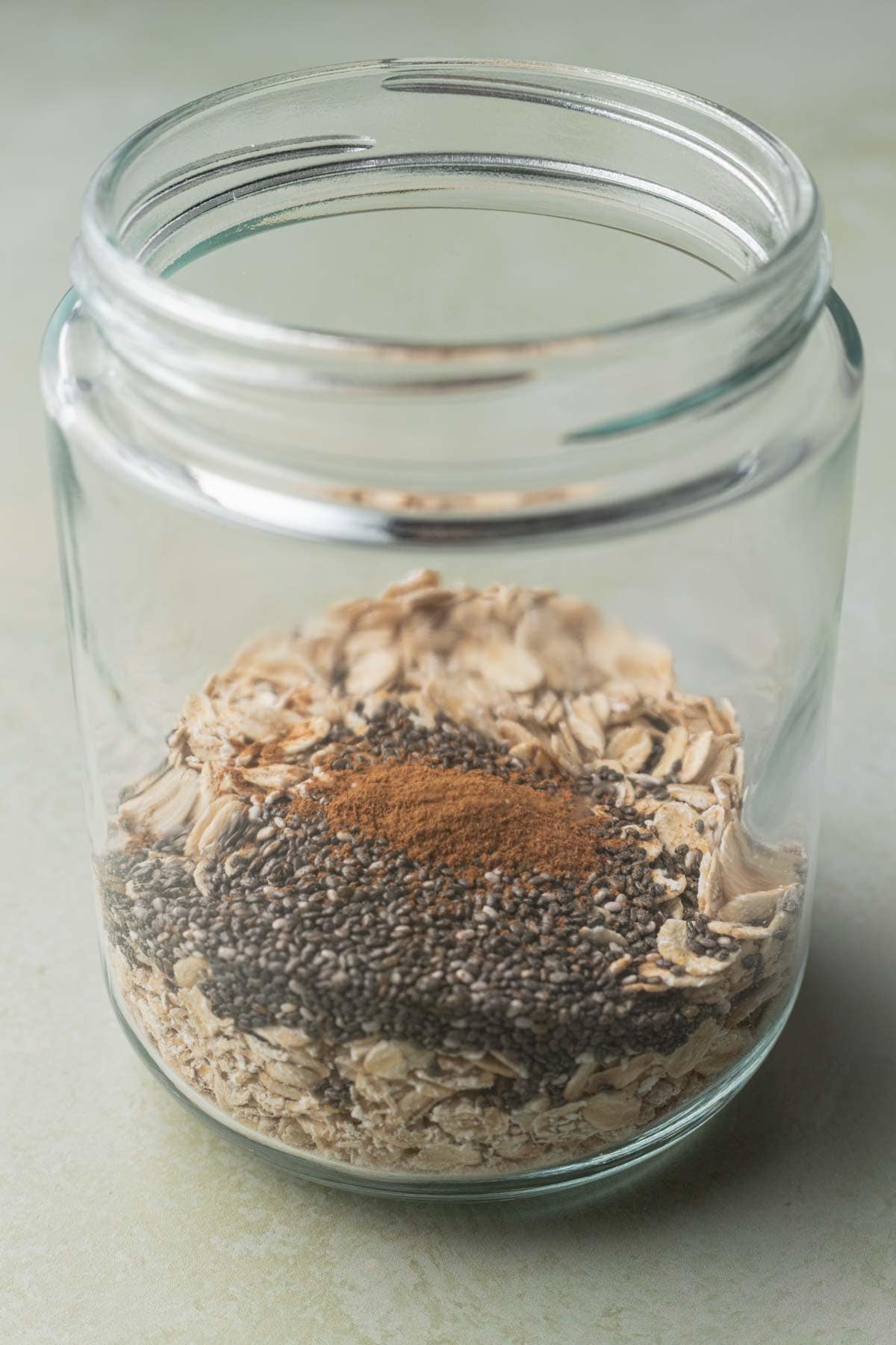 oats with chia seeds and cinnamon before mixing together.