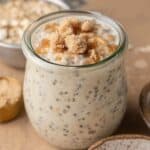 brown sugar overnight oats in a glass jar topped with extra brown sugar.