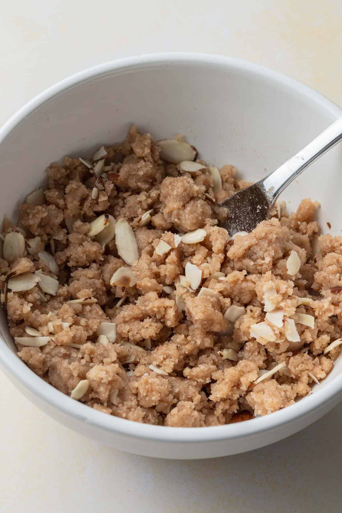 almond streusel mixed together in a white bowl.