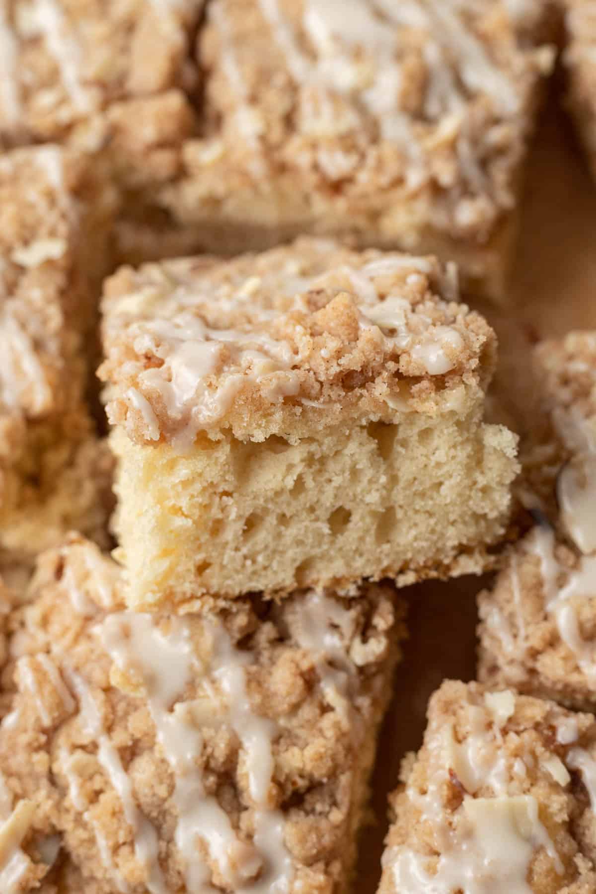 piece of almond coffee cake propped up on other slices.
