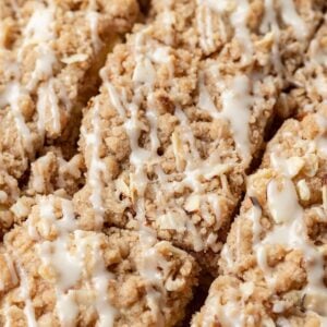 slices of almond coffee cake with icing drizzled on top.
