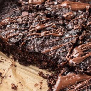 shot of sliced brownie baked oats topped with melted chocolate and flaky sea salt.