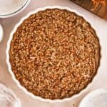 overhead shot of carrot cake baked oatmeal in a round white dish